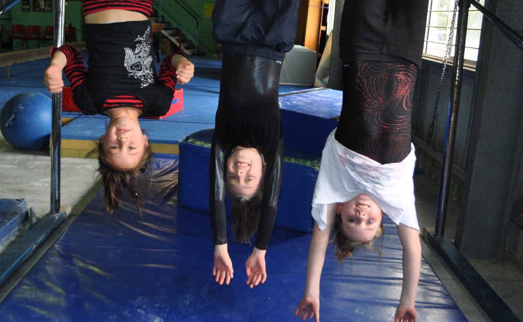 Nikita Kuzma, Cortney Carniel and Emmersen Mackie are excited for new mats for the club.